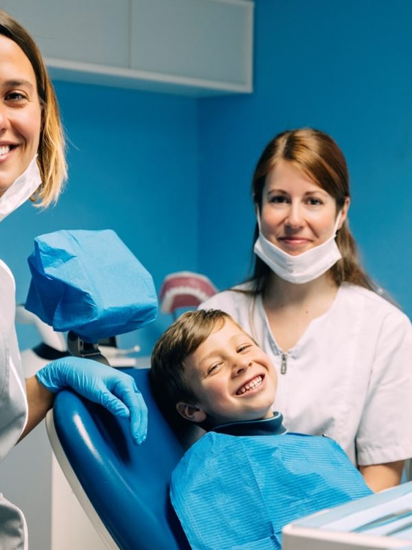 portrait-of-dentists-and-child-patient-2021-08-27-22-49-33-utc-min.jpg